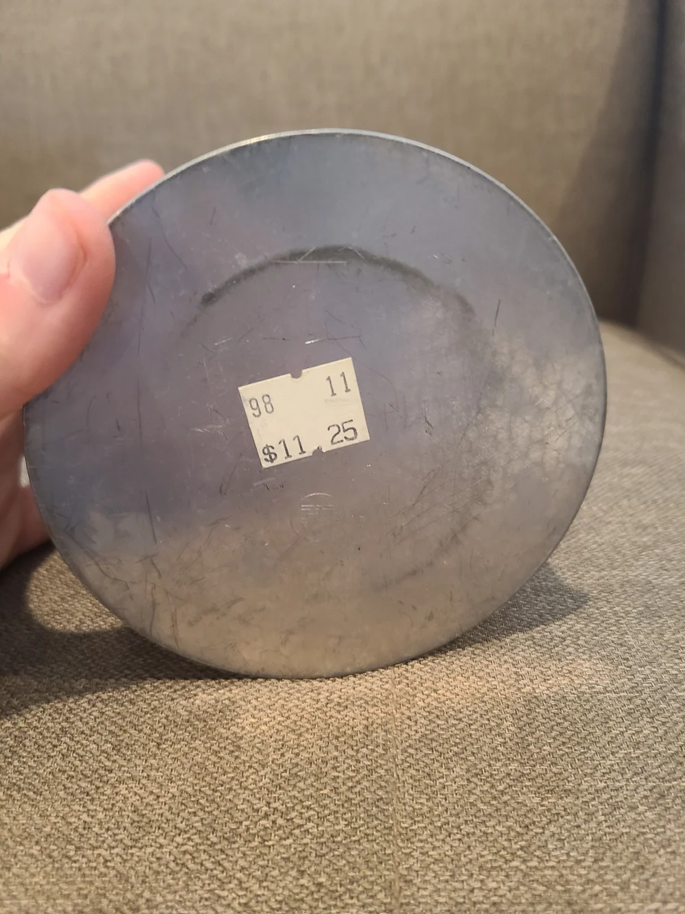 Primitive Irvin's Punched Tin Lamp featuring a distinct apple